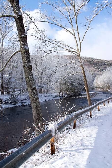 River runs along the house. Trout fishing right on our property.