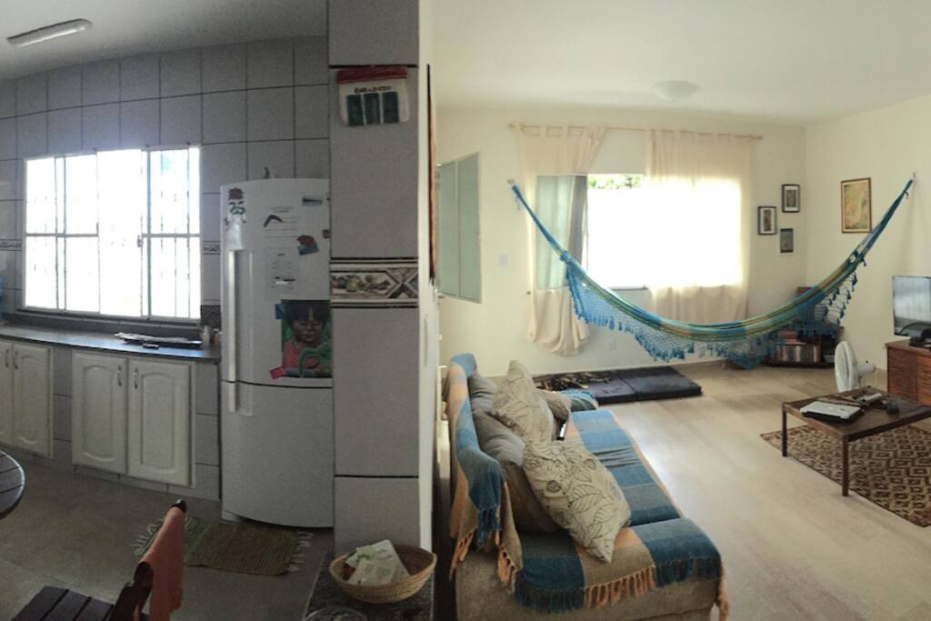panoramic image of the kitchen, living room and work space