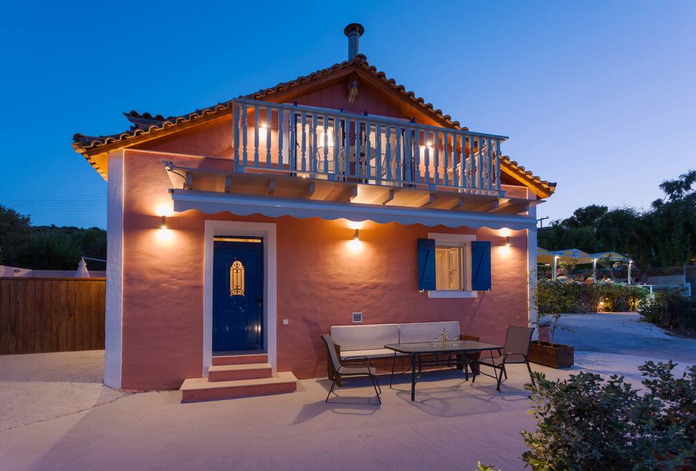 The front part of our cottage and the private yard with BBQ and sunbeds at the right side of cottage