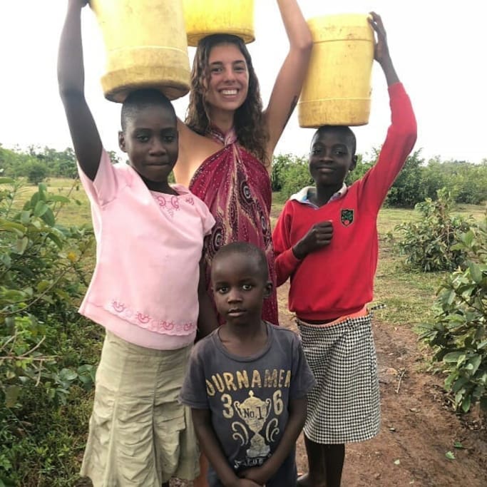 One of our guests volunteered to help the girls bring water back to the village. She learned to cook local food and speak the local language while staying with us!