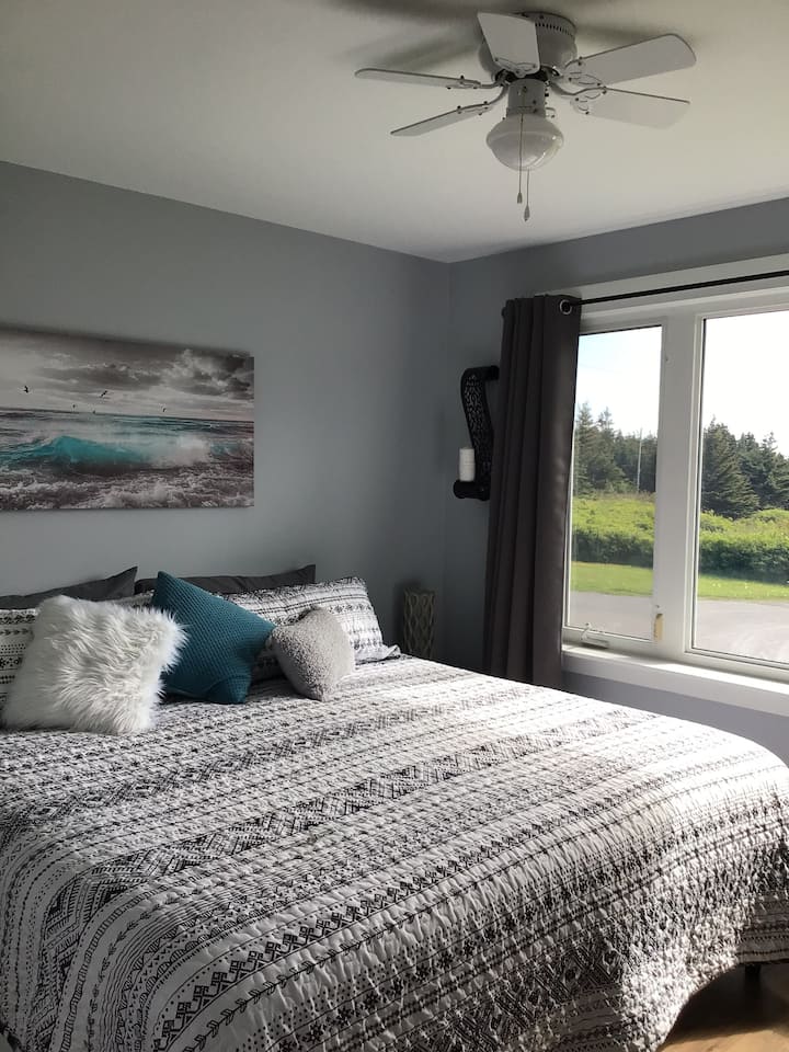 New bedroom downstairs with a King size bed….beautiful view of Pebble Beach