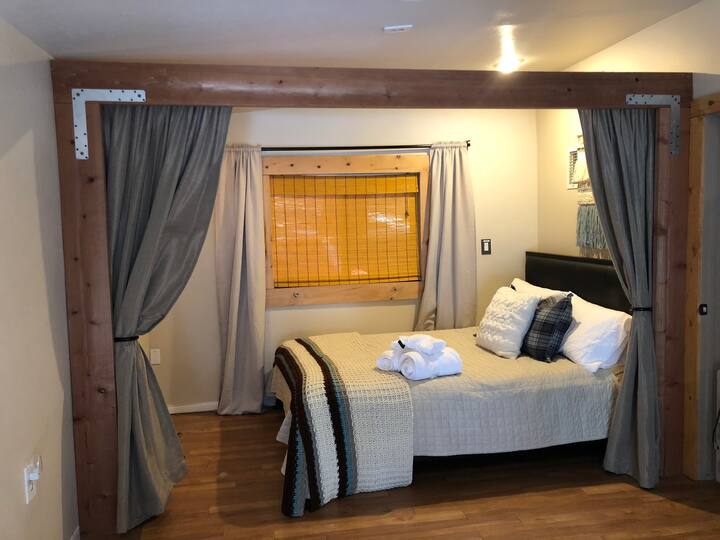
Queen bed with room dividing curtains for extra privacy