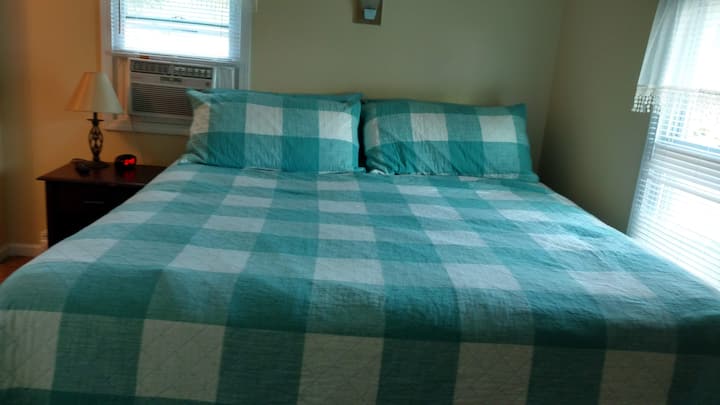 Master bedroom with a king  bed and flat screen TV