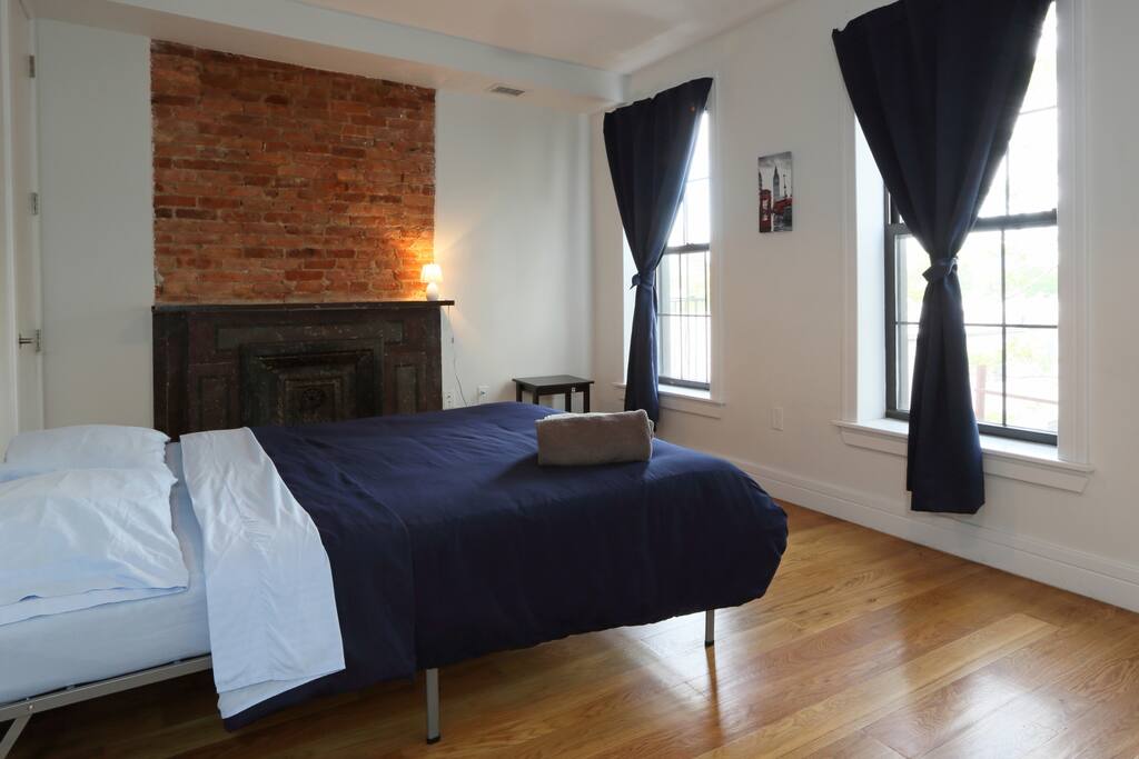 Queen-size bed, three windows and blackout shades