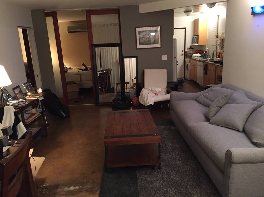 Living room area complete with sliding doors to bedroom
