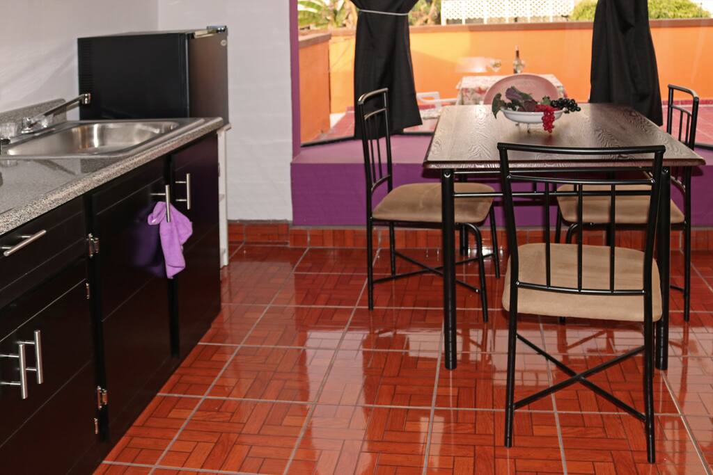 Enjoy your meals in front of a large window overlooking the terrace.