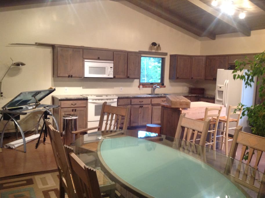 View of conference room table and kitchen from SW corner.