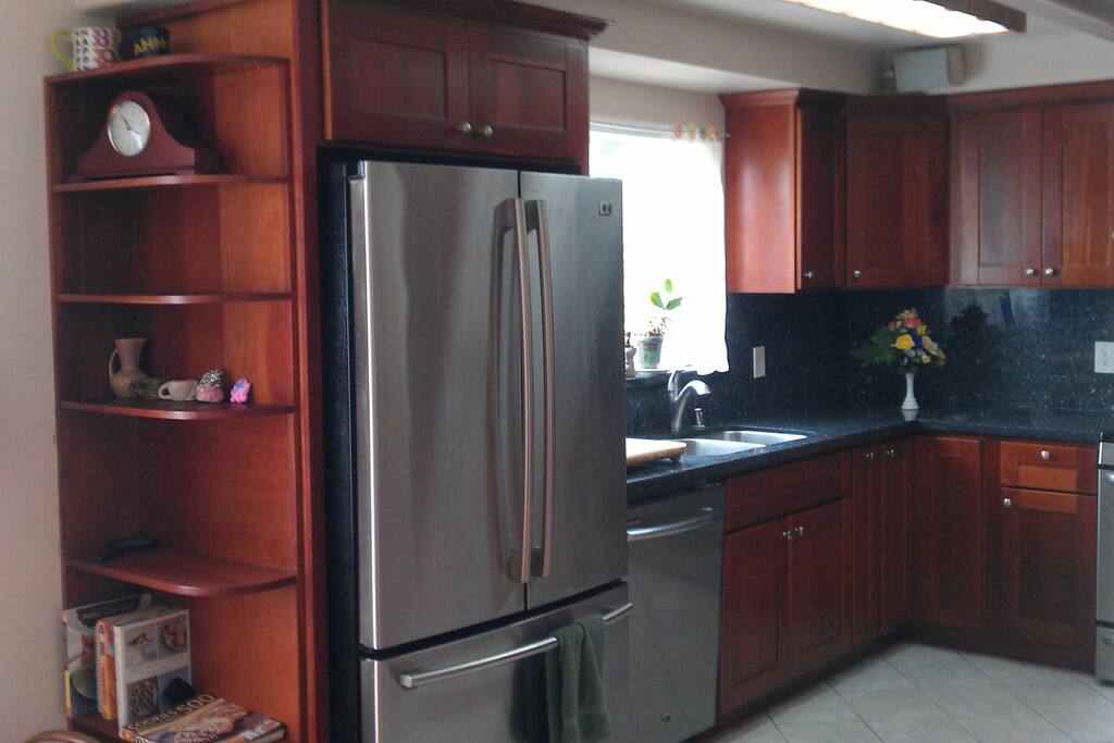 Large refrigerator and dish washer.