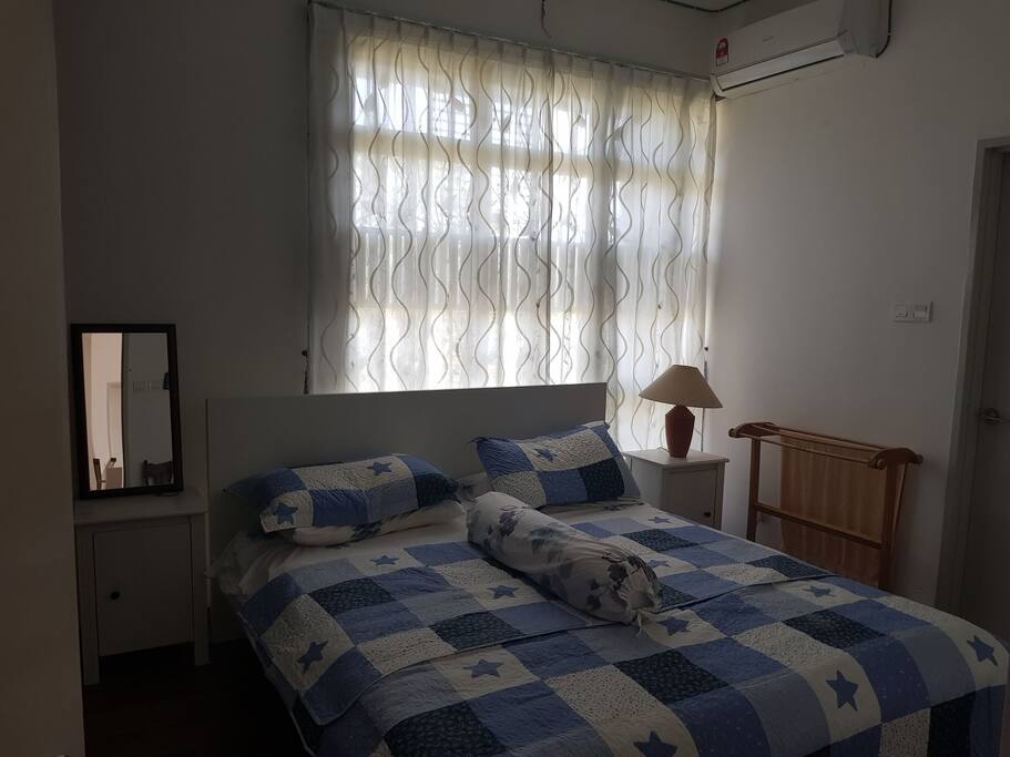 Main bedroom with kingsize bed, wardrobe and attached bathroom with hot shower