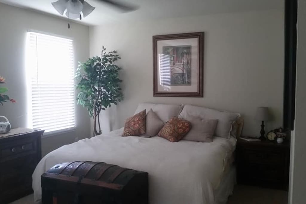 King size bed with washed linen comforter.