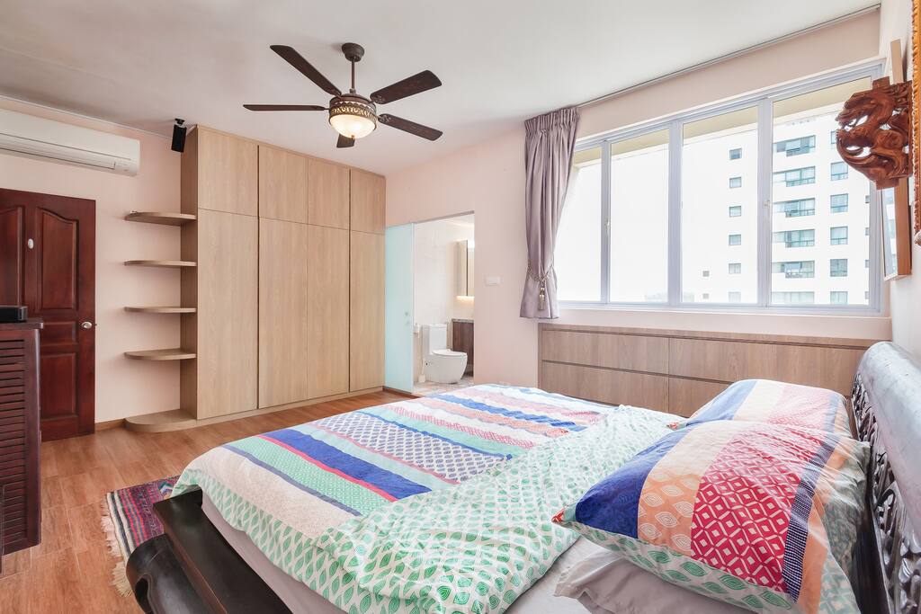 Large air conditioning unit, ceiling fan and ample window space allowing light to come in.