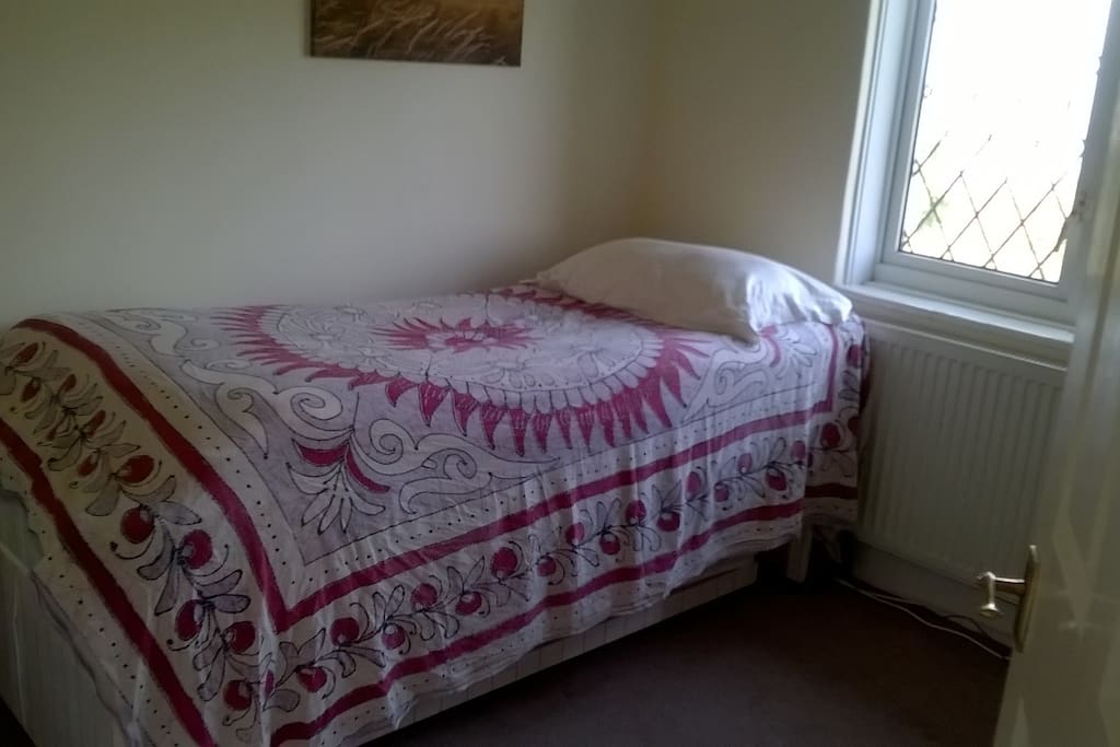 Single bed in a sunny room