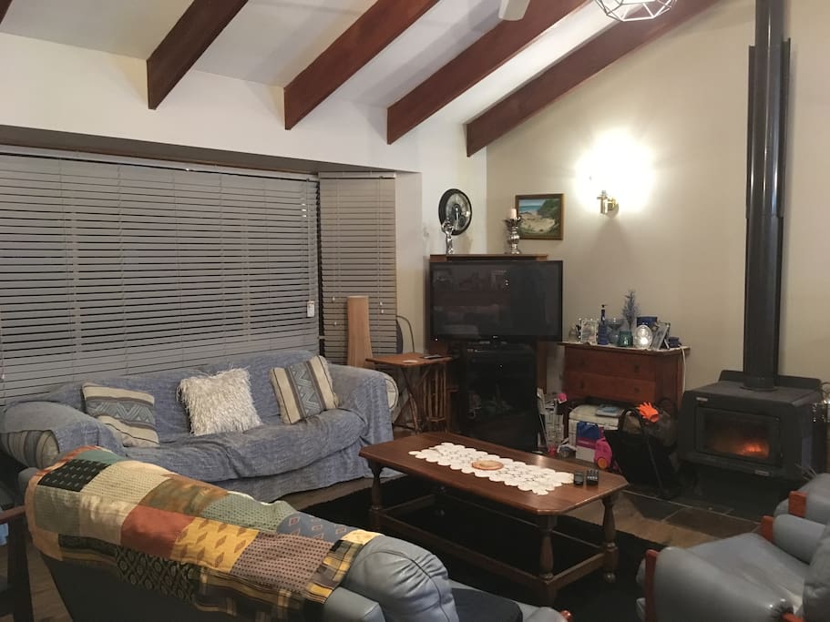 Comfy lounges in front of fire on chilly nights.