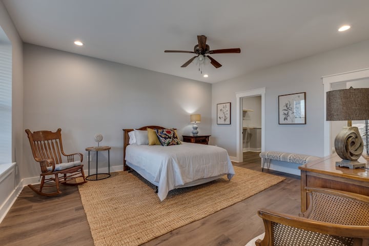 Spacious ground level bedroom with bathroom and washer/dryer.