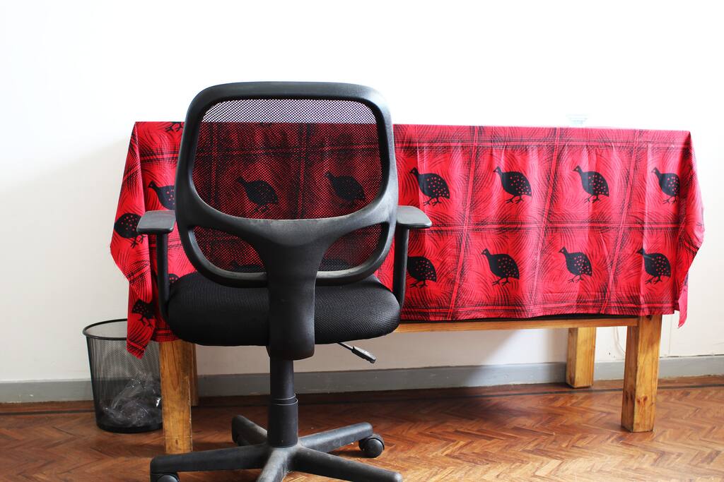 Desk in your room. The desk has a small built in storage space underneath.