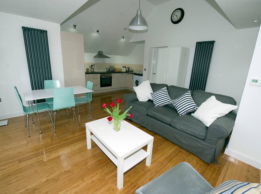 Open plan living room with bi-folding doors to the large deck and garden. Fully equipped kitchen.