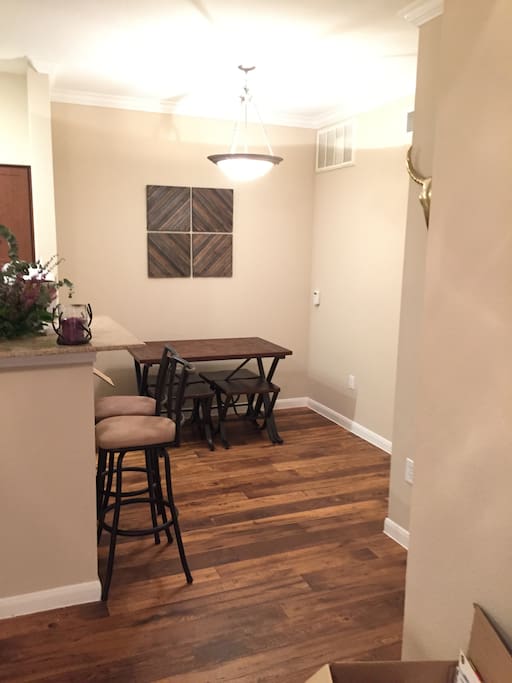 Kitchen eating area. Table with four stools