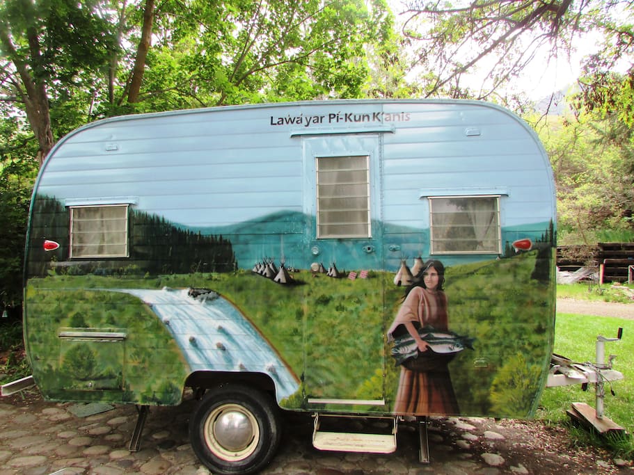 Hand-painted mural over entire camper.