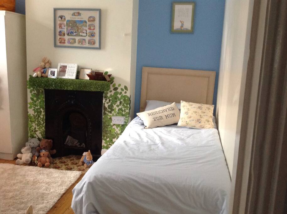 Our son's bedroom with full size single bed and 70x140 cot bed