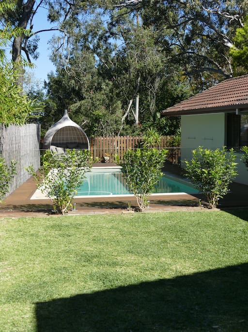 Garden area adjacent to the pool, great for kids!