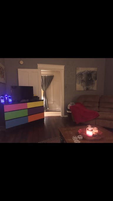 living room with reclining love seat