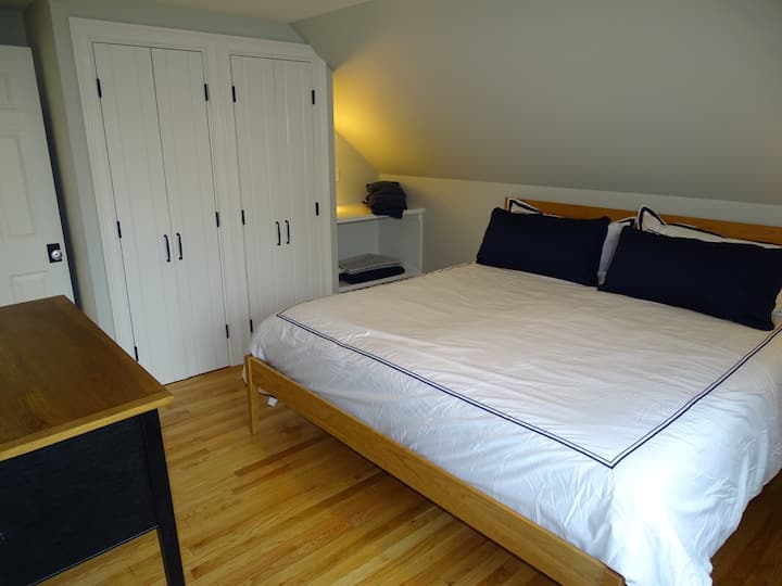 King bed in Master Bedroom, along with both hanging and shelf closets.  