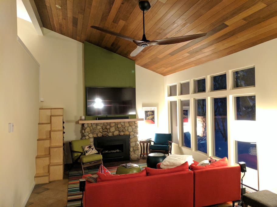 Living area with 4k TV and gas fireplace.
