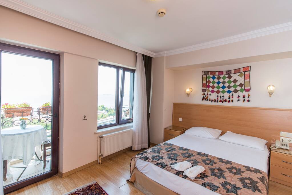 Clean, comfortable, modern room. Air-conditioned & Furnished with comfortable beds. Kettle & cups with complimentary tea bag, herbal tea, nescafe, cakes. A minibar supplied with complimentary water & mineral water. LCD TV with international satellite channels, bedroom slippers and standard toiletries, a hair dryer & free Wi-Fi connection. Daily cleaning. Laundry & Ironing service for a small extra cost. Non-smoking rooms.