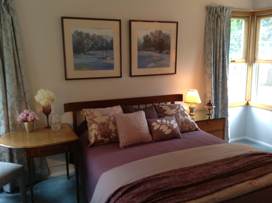 Bedroom with full size bed on side one