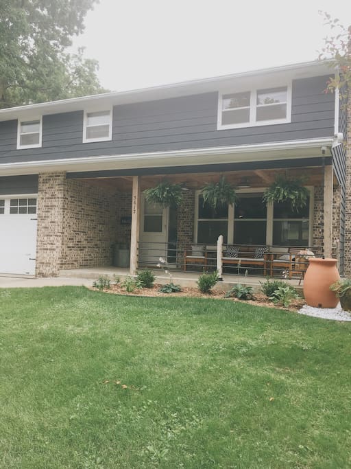 Front of house with porch and seating! Block from the arboretum and lake wingra!