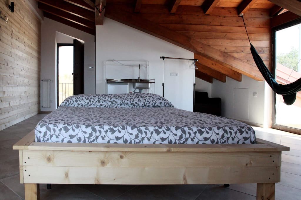 The main bedroom and the sofa bed, located in a little alcova