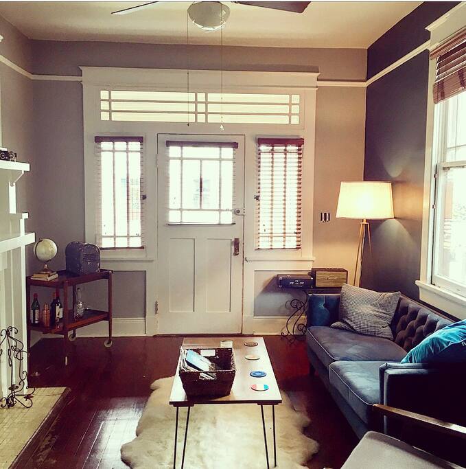 When I bought my home I wanted to create my dream space. Having a living room that was both comfortable yet stylish was important. It all started with the color of the accent wall and knowing how much I loved the angles and simplicity of Mid-Century decor. Putting Mardi Gras beads all over the house didn’t interest me, but neither did plain white walls. The table was the first piece of furniture I built. Took me 3 separate pieces of wood because I didn’t know how to properly stain the wood and kept getting drip marks. It was also the first time using my new drill and I stripped a screw before it went in and can’t get it out. I figure nothings perfect, but I love how it was the first piece I made.
