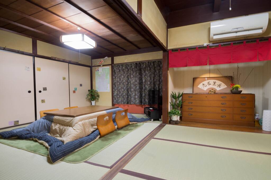 The living room with a kotatsu (a Japanese style table with a heating element under it! It's very cozy :) )