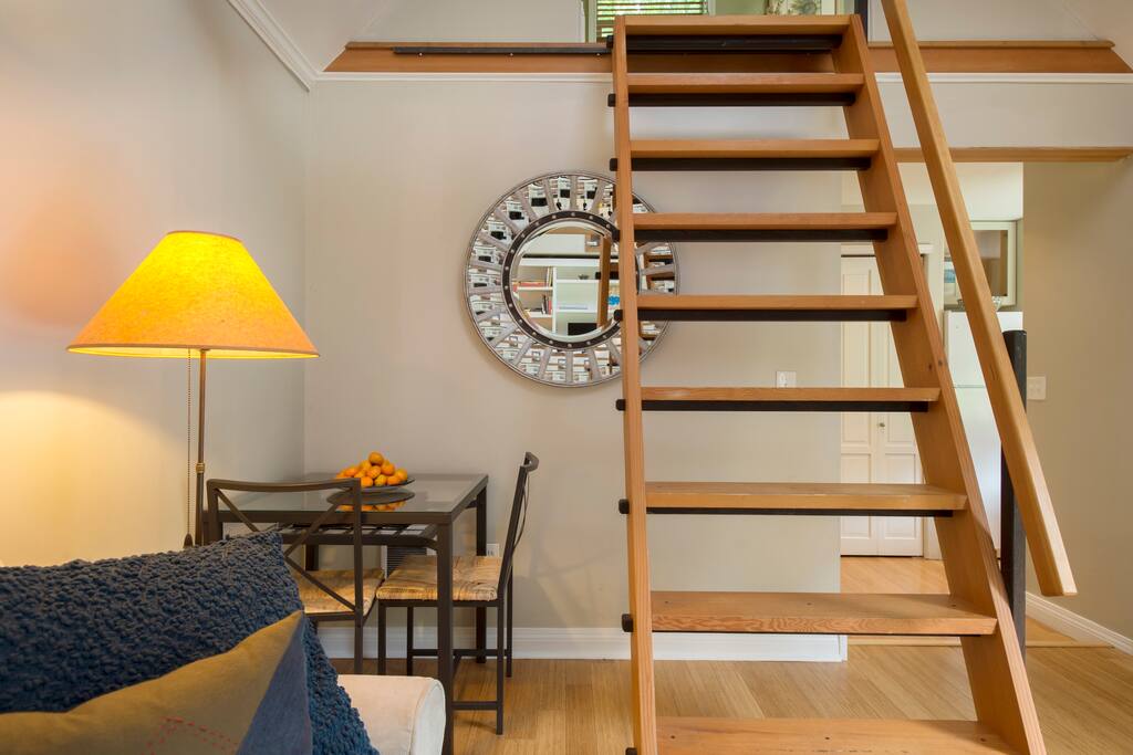 Stair/ ladder with handrail leading to loft