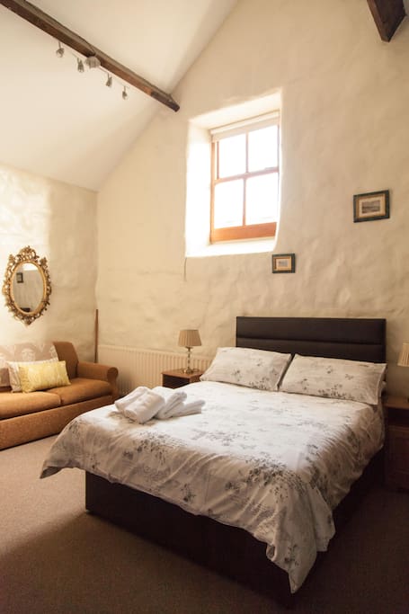 Double room with original stone walls and wooden beams