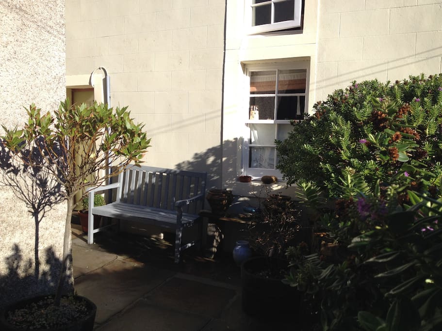 Front of the house with sunny bench