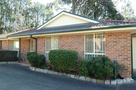 Home (no steps) in quiet area next to a reserve.