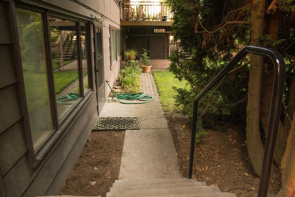 Go through gate on your left and down five steps. Apartment has its own entrance.
