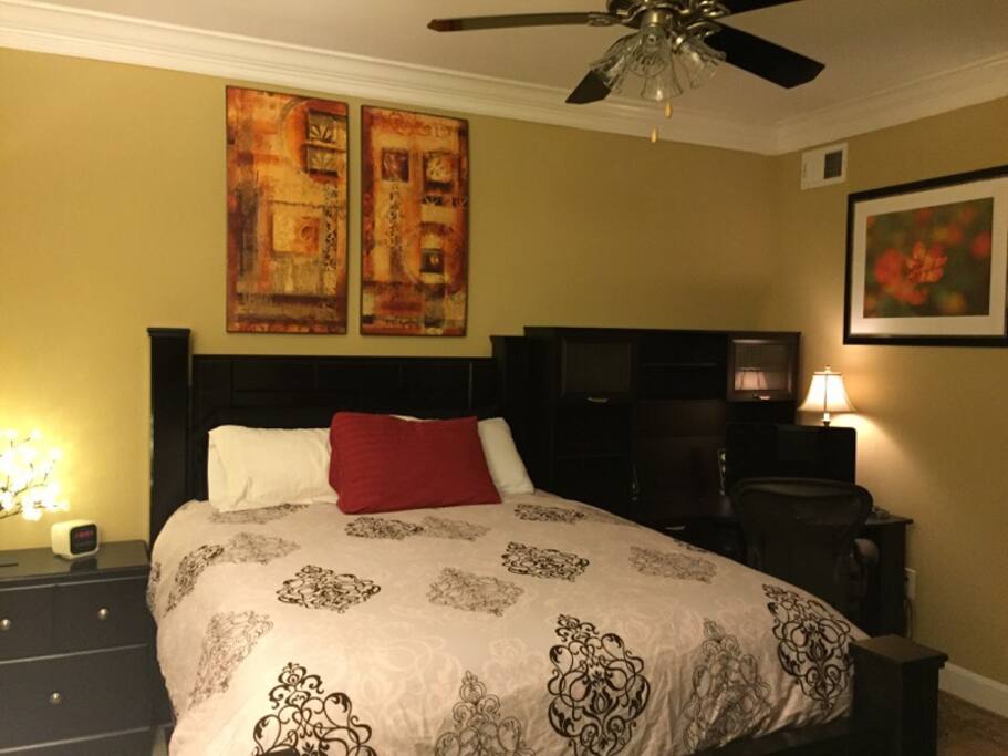 bedroom with spacious desk and brand new, comfortable simmons beautyrest recharge mattress