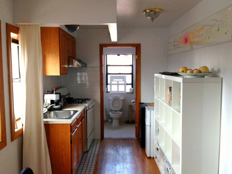 This is the view of the space from the front, with a piece of my art above the shelving on the right.