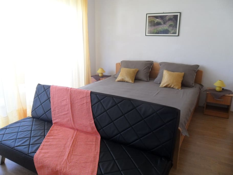 The bedroom with the balcony and partial seeview.