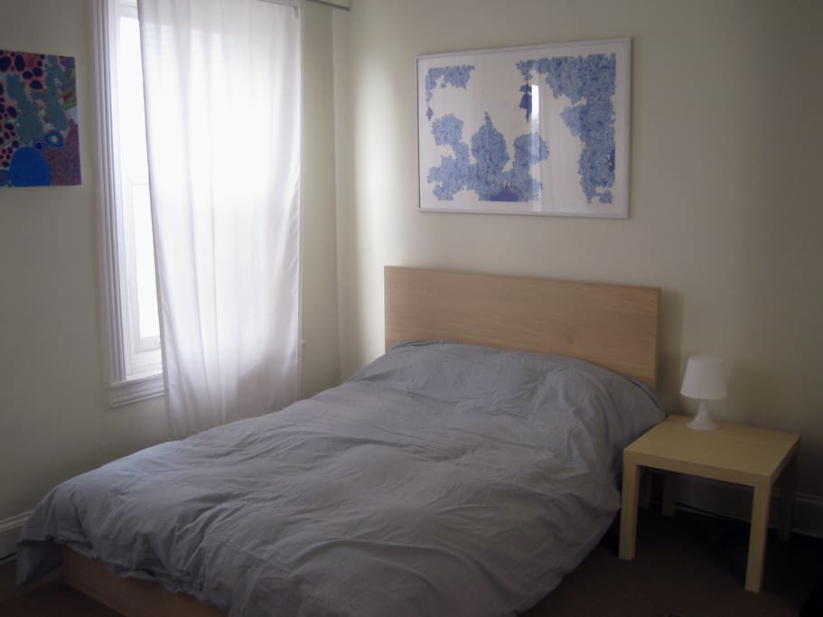 The framed piece above the bed is titled "Pillow Talk" - perfect spot for it. Soothing colors and imagery for a restful stay away from home.