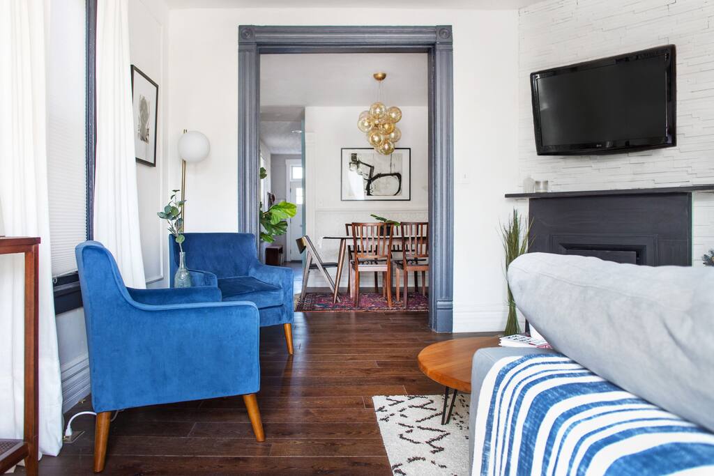 Front room - living room with sectional sofa, 2 lounge chairs. 4k LED Roku TV with Sling and Netflix.