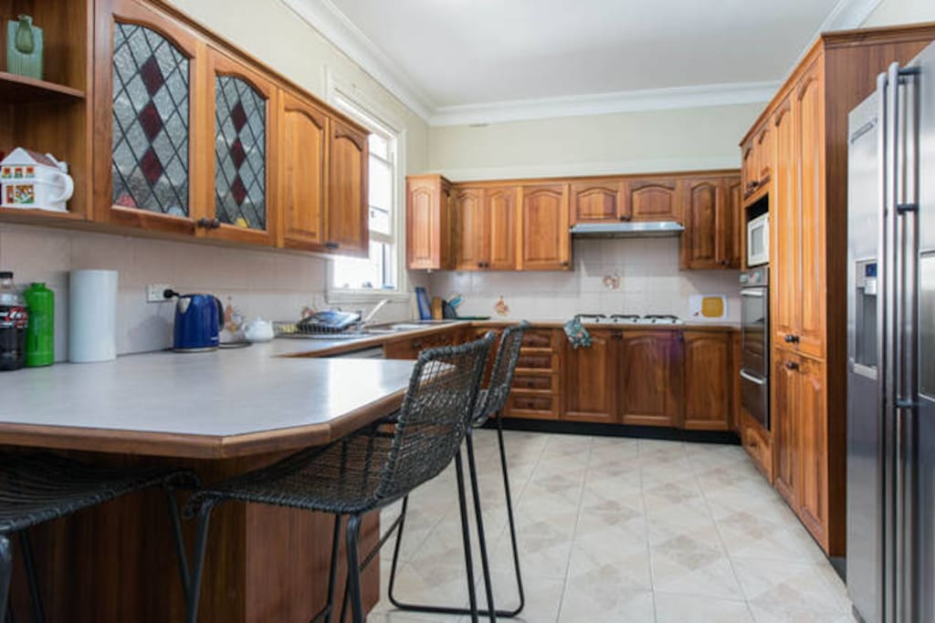 Double door fridge with water filter and ice maker.