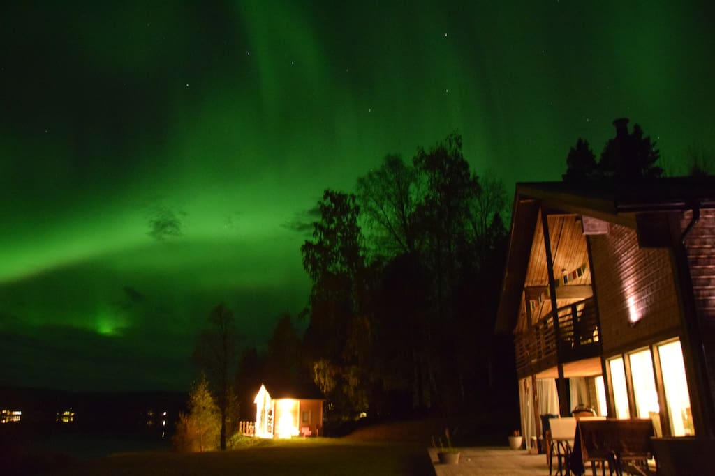 Northern Lights over the house and cabin.