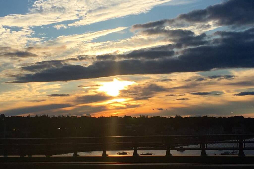 Sunset over the Merrimac river bridge nearby