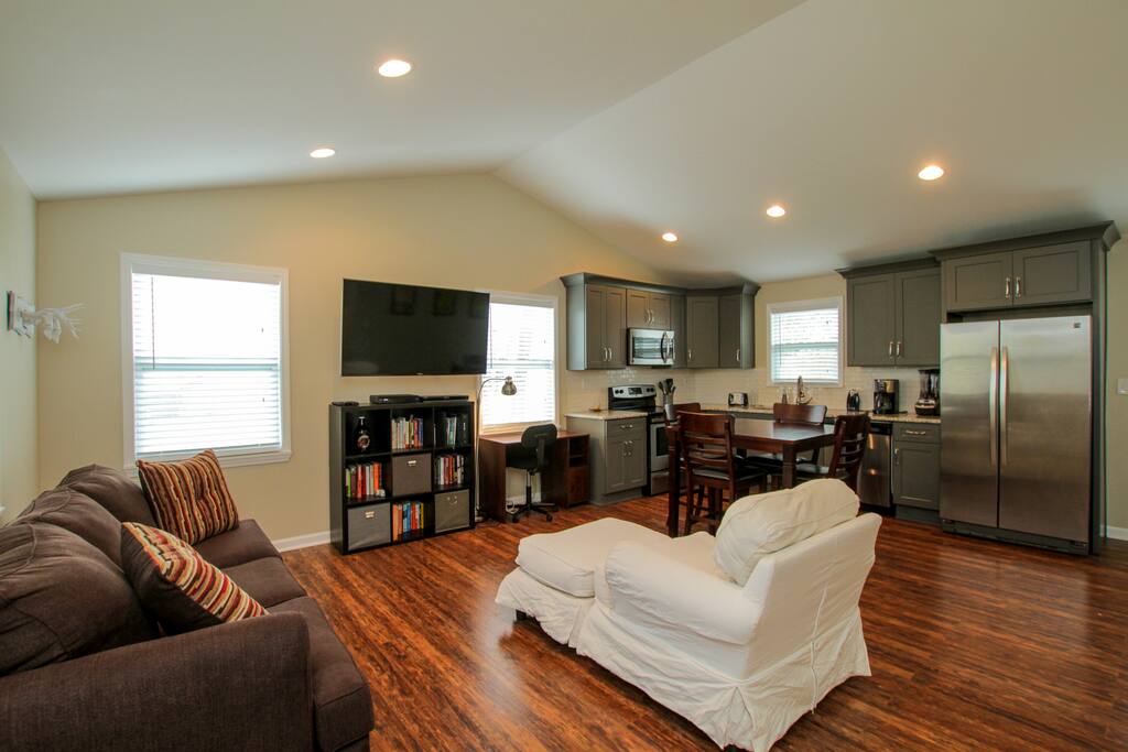 Dark hardwood floors flow throughout the main living area