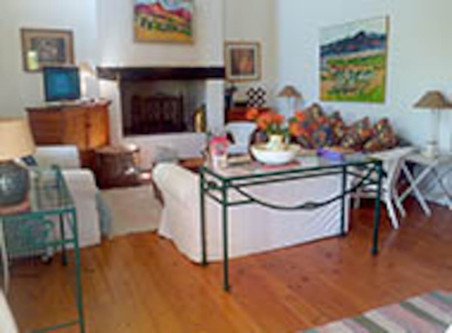 Lovely open plan lounge with fire place and DSTV