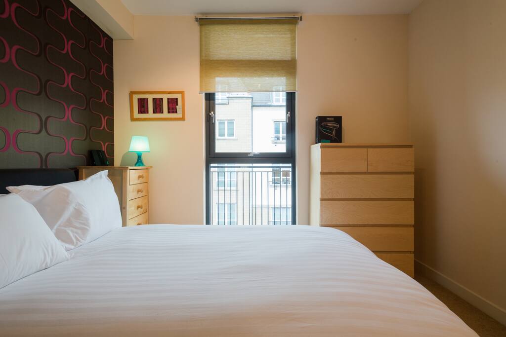 Brown leather (and very comfortable) double bed. Sliding wardrobe and wall mounted TV