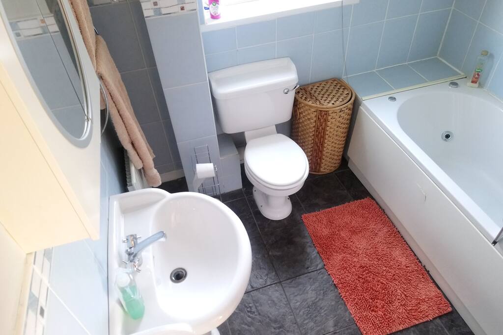 Bathroom with bath and shower.